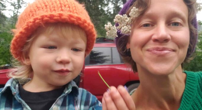 Dr. Sarah Sue Myers and her son Leo explore herbal remedies in the garden.