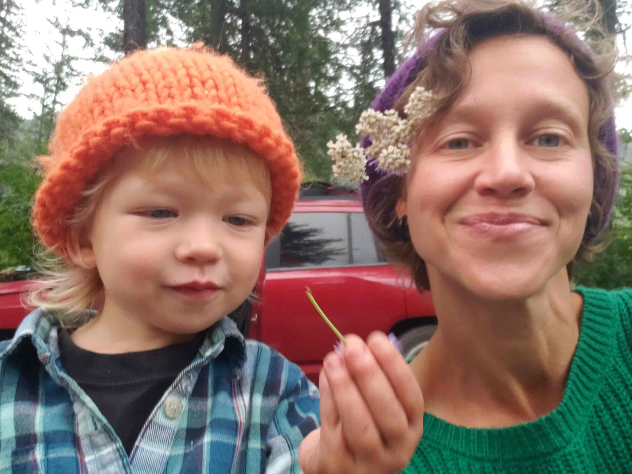 Dr. Sarah Sue Myers and her son Leo explore herbal remedies in the garden.