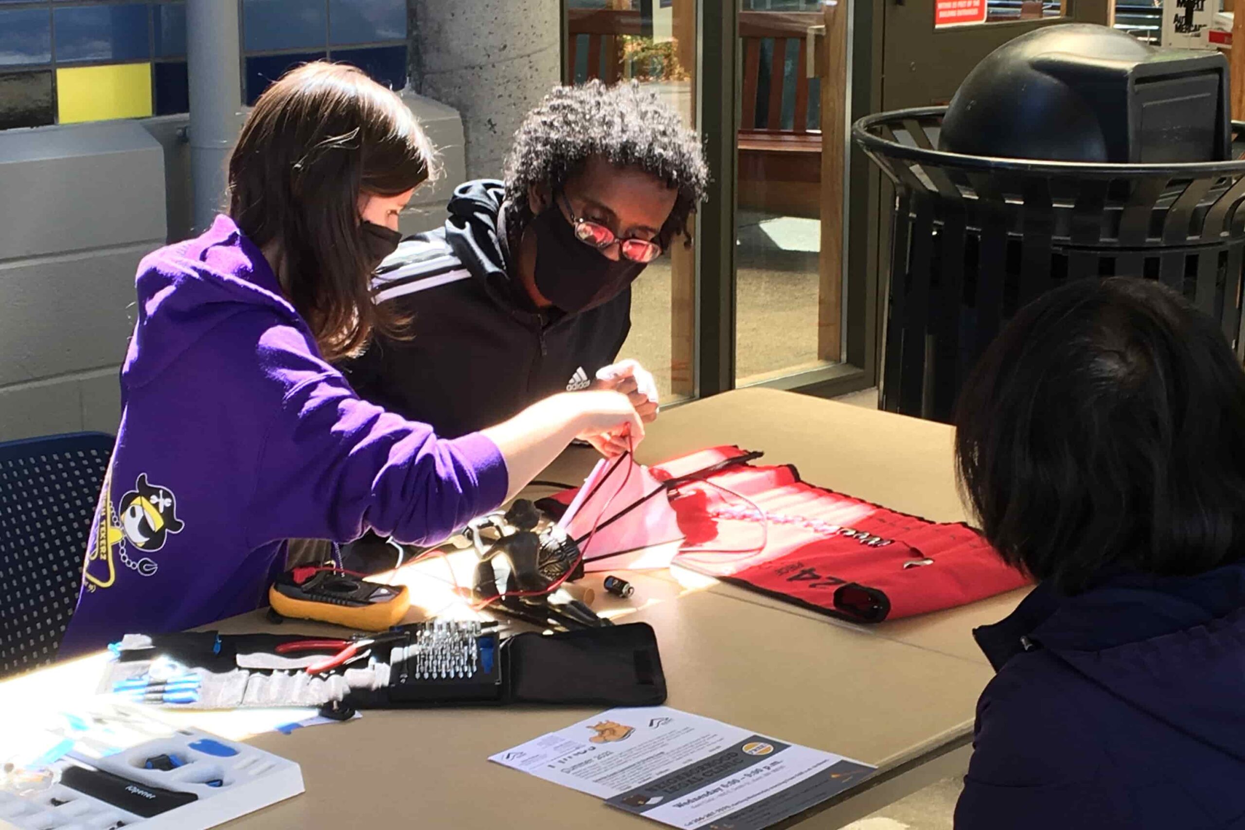 Fixers at King County's Fix-it-Fair work on a project.