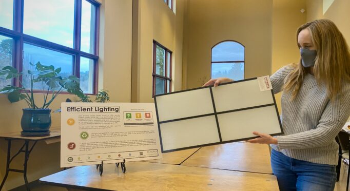 Facilities Manager Kelly Rankich displaying energy efficient technology in the 21 Acres Great Hall