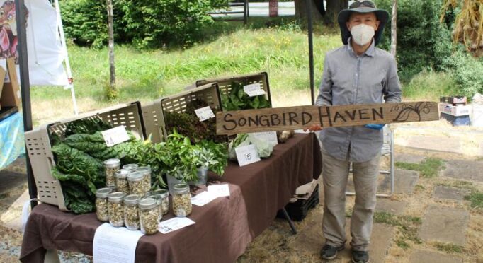 Mark of Songbird Haven Farm poses at a recent pop-up market event at 21 Acres.