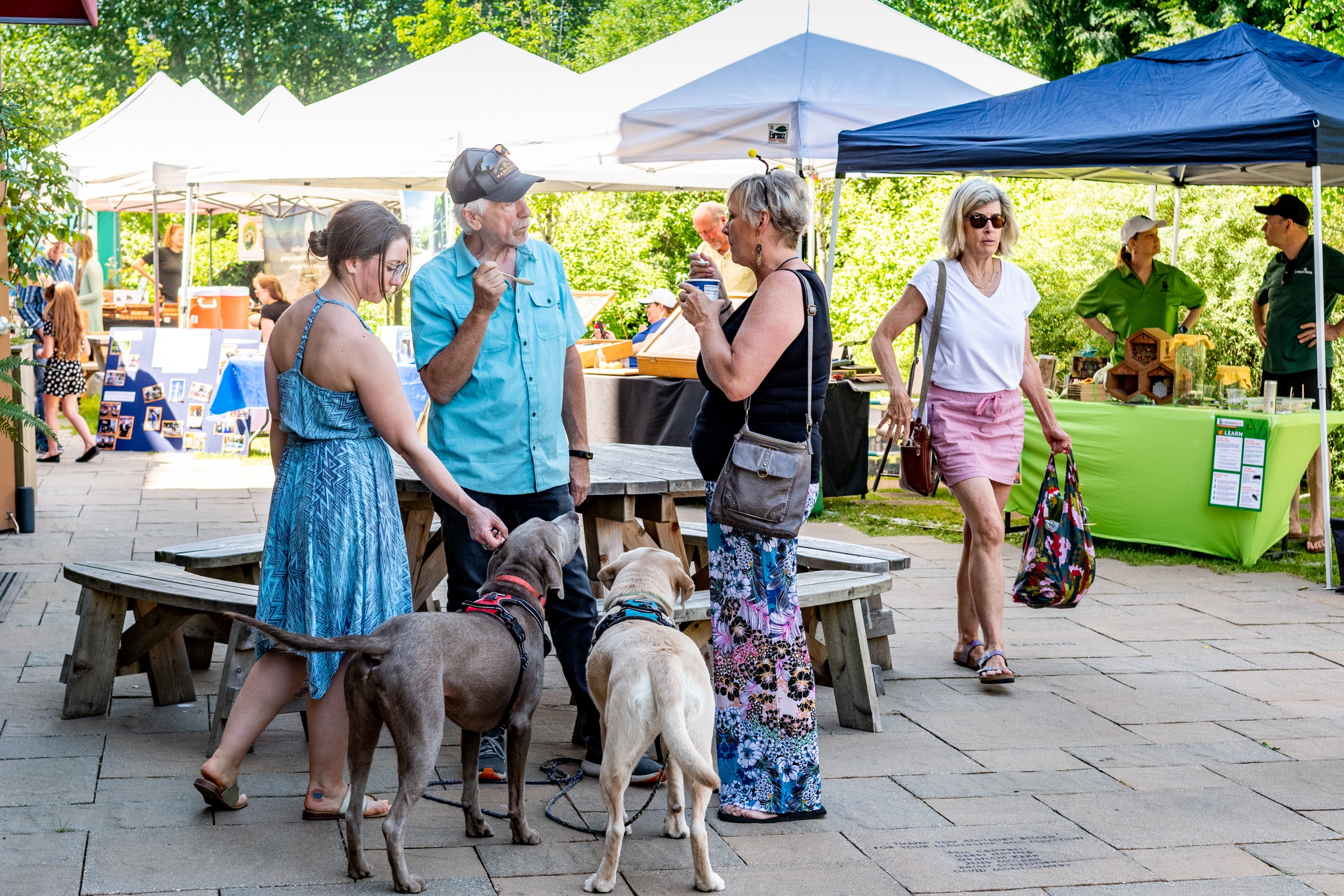 Shoppers and visitors enjoy a popup market on the 21 Acres Farm Market patio.