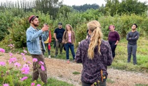 Farmers Dakotah and Lynnea sharing concepts of regenerative agriculture during a tour of the 21 Acres farm.