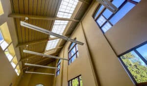 The 21 Acres Great Hall uses high ceilings, Kalwall skylights, and motion-sensor LED lights to reduce energy usage.