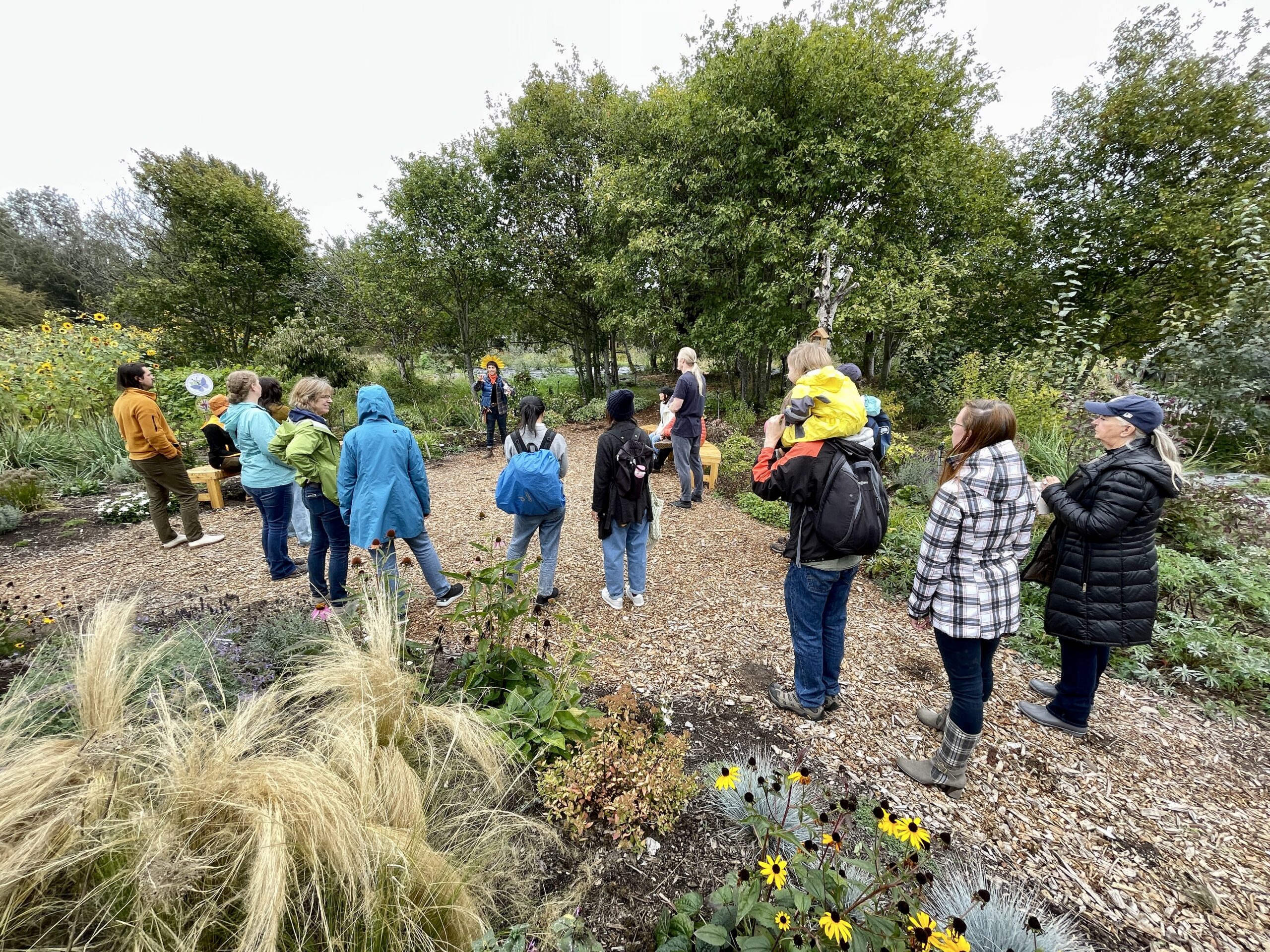 Visitors enjoy learning about the role of pollinators in regenerative agriculture during a Farm Walk event.