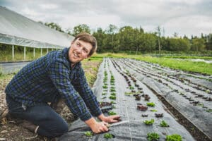 Farmer Erik Goheen plants lettuce starts at Sammamish Farms.