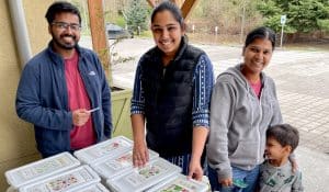 Gardeners look through the bins at the Sammamish Valley Alliance annual Seed Swap at 21 Acres.