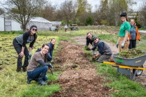 Earth Day volunteers weed an insectory bed.