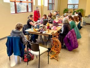 A group of knitters meet in the upstairs meeting room at 21 Acres.
