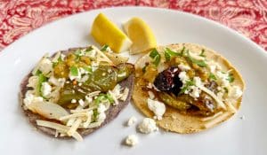 Tacos made from fresh masa torillas and salsa in the 21 Acres kitchen.