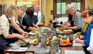 Ron Askew teaches a cooking class on how to make masa tortillas in the 21 Acres kitchen.